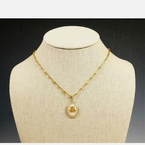 Catherine Popesco Gold Bee Pendant Necklace w/gray crystals around the pendant